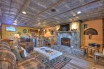 Lower Level Den with a Flat Screen TV, Gas-Log Fireplace and a Wet Bar with a Mini Fridge